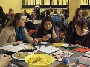 Sarah Richmond, Madeline Migul and Caroline Williams play a round of Uno at the final SLUsh event in Stuyvesant Hall. 