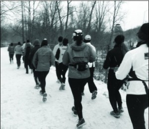 The 12-minute pace group from the Marathoners In Training (MIT) running club braves the snowy weather to complete a run at Antrum Park in Worthington. 