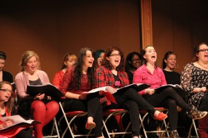 Cast members in “The Vagina Monologues” laugh during a rehearsal. In the front row, from left to right, freshman Ellen Hughes, senior Madeline Shier, sophomore Zoe Crankshaw, junior Nora Anderson and junior Margaret Knecht.