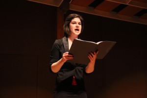 Junior Kati Sweigard reads during her monologue “For My Sisters in PortAuPrinceBukavuNewOrleans.” 