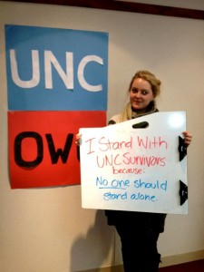 Sophomore Liz Nadeau, one of the event planers, holds her sign of support for UNC-Chapel Hill sexual assault survivors. Other photos from the project are available on Facebook.