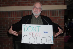 OWU Chaplain Jon Powers (left) with his own sign, ‘Don’t fear the color.’