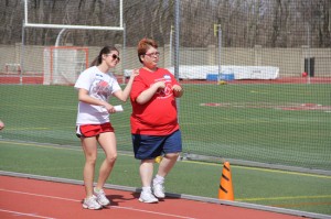 Junior Kate Nance (left) dances down the track during one of the Bishop Champion Games events. 