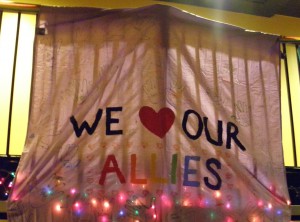 A banner celebrating allies of the LGBTIQA community hangs during Pride Prom