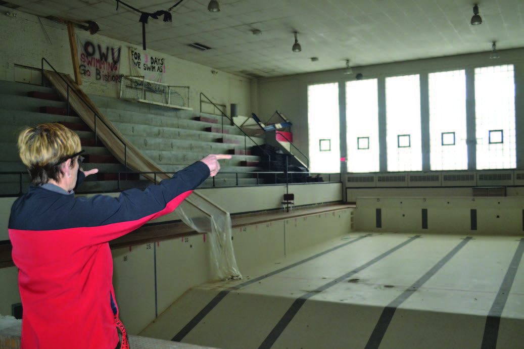 Nancy Knop points to the back area of the Natatorium where the Simpson-Querrey Fitness Center will be built. Photo by Breanne Reilly