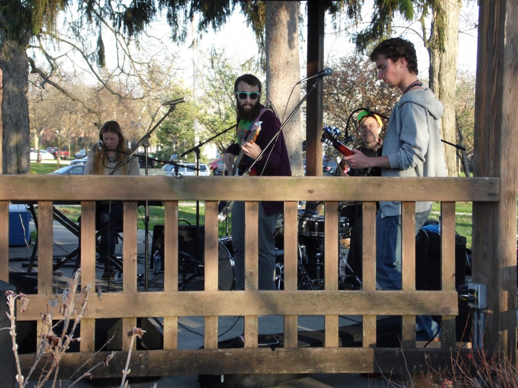 Wahoo Sam Crawford plays in the gazebo at Bicentennial Park, next to Rowland Avenue. Left to right: senior Erika Nininger on piano, junior Connor Stout on guitar, senior Michael Cormier on drums and senior Sam Sonnega on guitar. Photo by Spenser Hickey