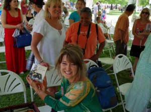 Morgan Treni '12 holds her CD at the Columbus Community Festival following her performance. Photo by Spenser Hickey,
