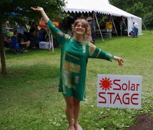 Treni stands next to the 'Solar Stage' sign after performance; she debuted at ComFest last year, also on the Solar Stage.