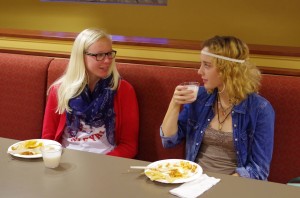 Sophomores Cajsa Ohlsson and Aletta Doran talk during the dinner, which also included music and instructions in traditional dance and a group performance of the Macarena. Photo by Spenser Hickey