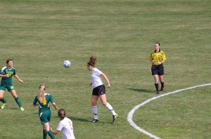 Sophomore Alyssa Giarrusso tries to head the ball forward to create an  opportunity on goal for a striker. Photo courtesy Don Hickey