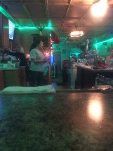 Senior Maria Urbina tends bar at the new Solar Saloon, located at 2 1/2 N. Sandusky St.
