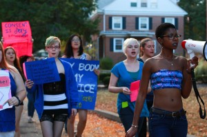 Junior Kaila Johnson leads the annual SlutWalk march around Williams Drive last Thursday. Photo by Alex Gross