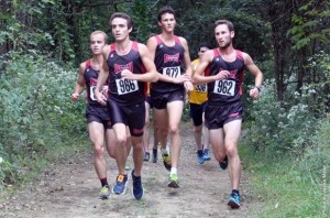 Members of the men's cross country team running at the Denison Invitational.