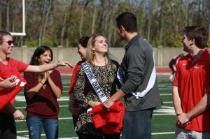 Homecoming queen, senior Brittany Hupp, glances up at king, senior Tom Horsfall, during the homecoming game Saturday, Oct. 25. Photo by Jane Suttmeier