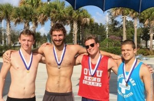 Four Ohio Wesleyan swimmers show off their medals earned at the Bob Mowerson Sprint Meet on Saturday.