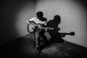 Drake Bell playing his guitar. Photo courtesy of Drake Bell's management.