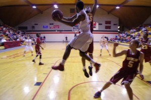 Junior wing Zak Davis passes the ball under the basket. Photo courtesy of Spenser Hickey.