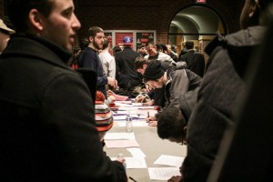 New fraternity members sign their bids on February 2. Photo courtesy of Alex Gross.