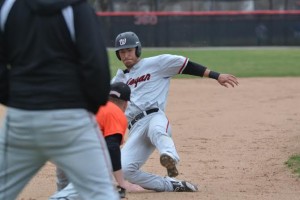 Junior outfielder C.J. Tosino tries to steal third base during a game against Ohio Northern on April 6.  Photo courtesy of Spenser Hickey.