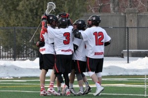 The men's lacrosse team celebrates together. Photo courtesy of battlingbishops.com.