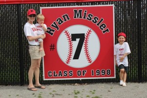 Members of Missler's family stand beside his banner. Photo courtesy of Spenser Hickey.