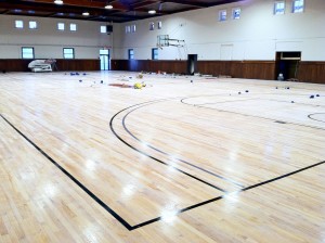 The Edwards Gymnasium basketball court shortly after being re-done during the 2013-14 school year. Photo by Roger Ingles and Larry Hamill.